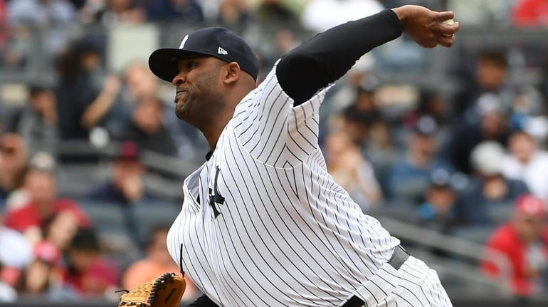 New York Yankees starting pitcher CC Sabathia delivers a pitch...