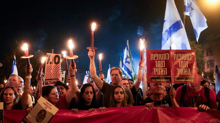 People march in a rally against Israeli Prime Minister Benjamin...