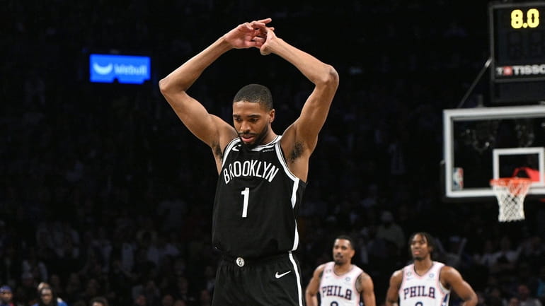Nets forward Mikal Bridges reacts late in the fourth quarter...
