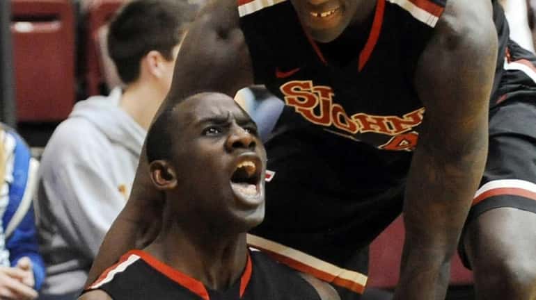 St. John's Sir'Dominic Pointer celebrates after getting fouled while teammate...