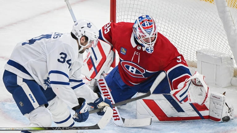 Toronto Maple Leafs' Auston Matthews (34) moves in on Montreal...