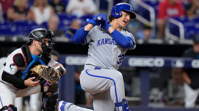 Kansas City Royals' Nick Pratto reacts after striking out swinging...