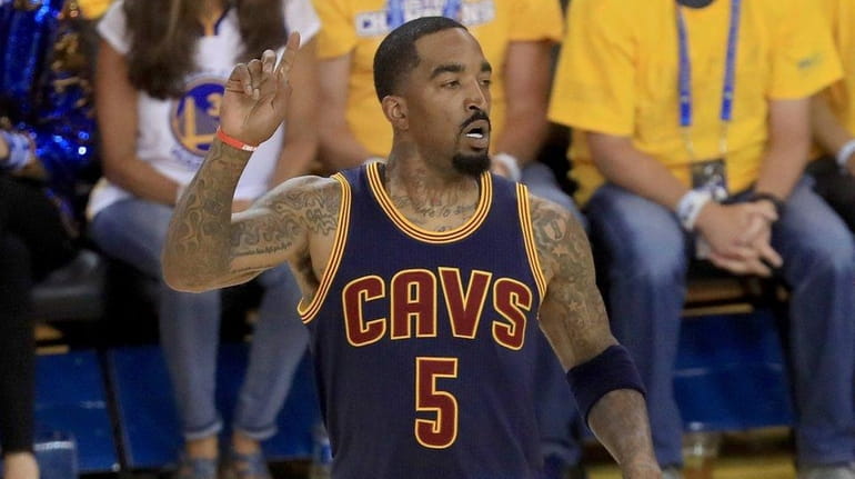 J.R. Smith, No. 5 of the Cleveland Cavaliers, reacts to...