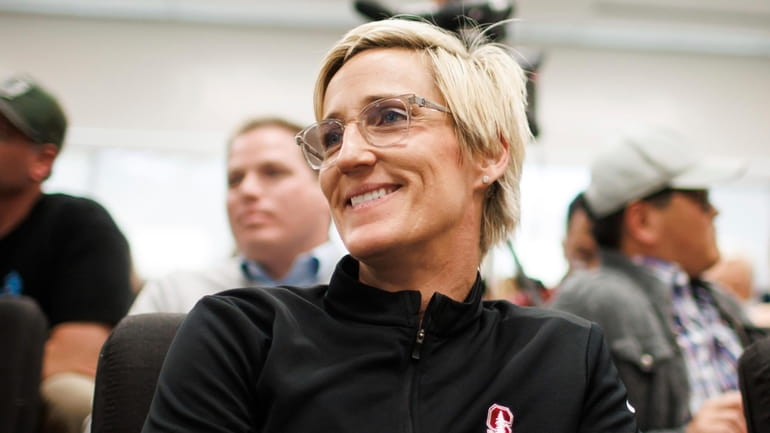 Stanford associate head coach Kate Paye listens to VanDerveer during...