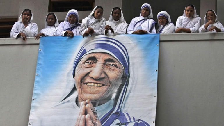 In Calcutta, India, nuns of Mother Teresa's order, the Missionaries...