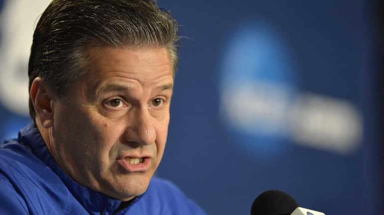 Kentucky head coach John Calipari answers a reporter's question during...