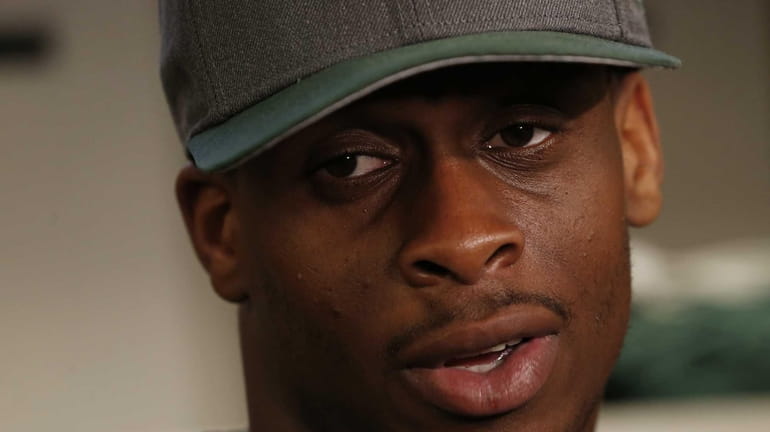 Geno Smith of the New York Jets talks to reporters...