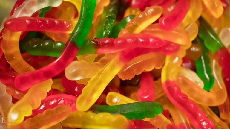 Gummy worms, containing 10 milligrams of cannabidiol, are displayed at...