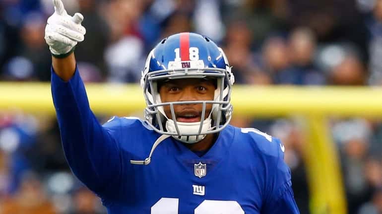 Bennie Fowler of the Giants signals first down after making...
