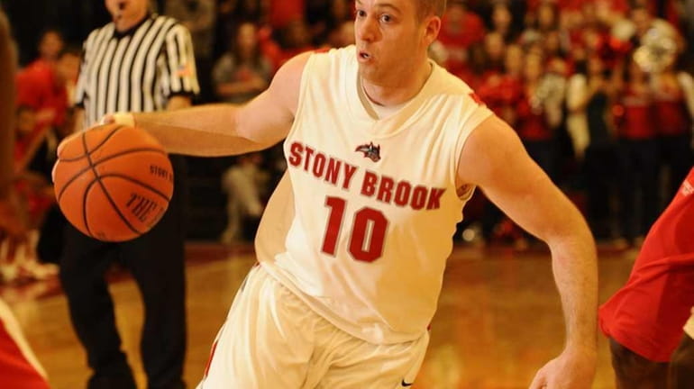 FILE - Stony Brook University's Bryan Dougher controls the ball...