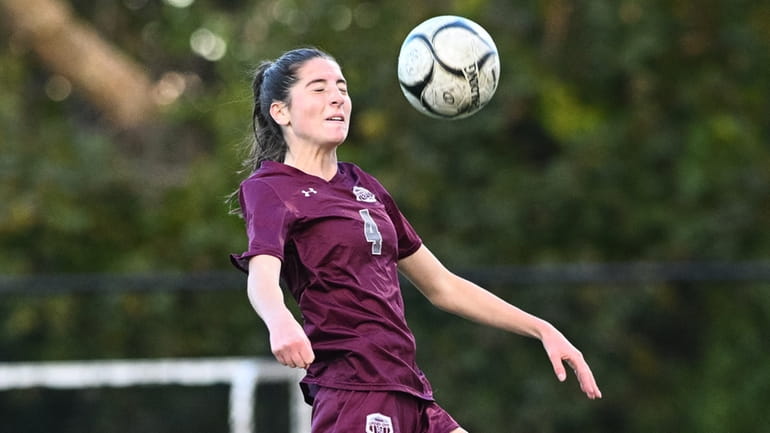 Briana Ciccone of Garden City attempts the header into the...