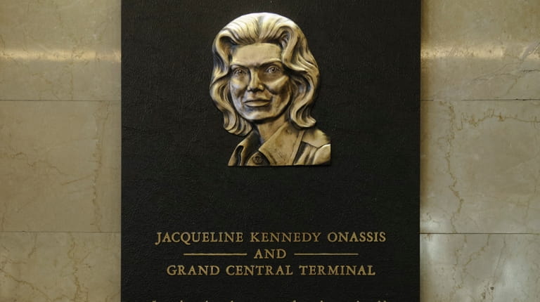 A plaque honors Jacqueline Kennedy Onassis' efforts in the 1970s to...