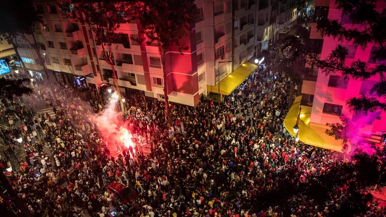 Thousands of Moroccans gather to celebrate Morocco's win over Spain...