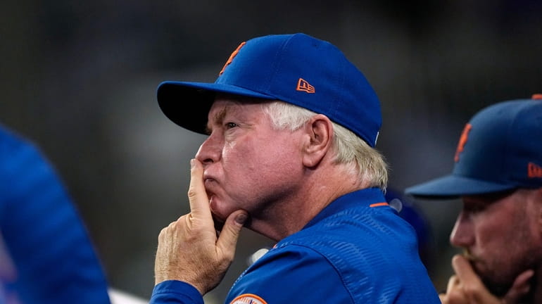 New York Mets manager Buck Showalter watches from the dugout...