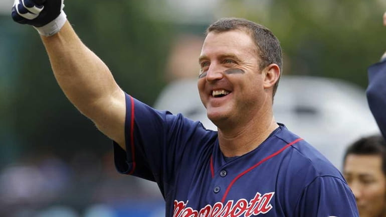 Minnesota Twins designated hitter Jim Thome gives the thumbs-up to...