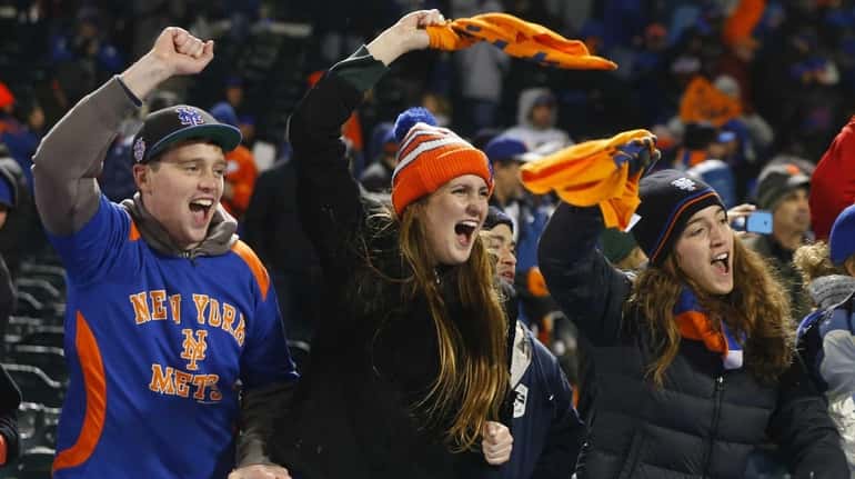 New York Mets fans celebrate the win during Game 2...