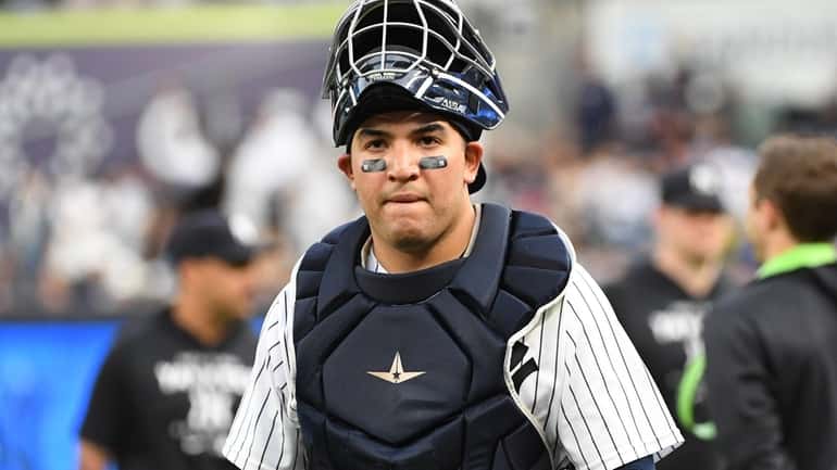 Yankees catcher Jose Trevino walks to the dugout before an...
