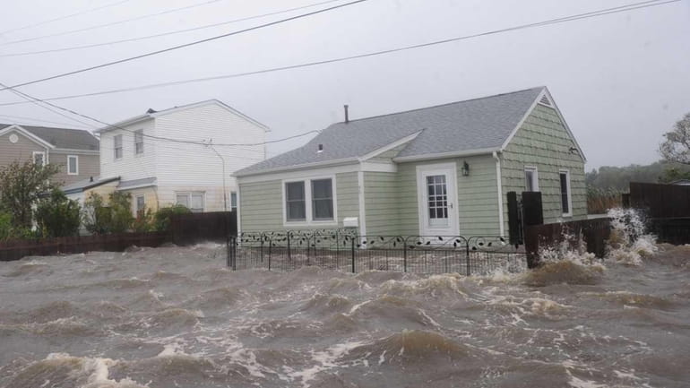 The tide floods a house in Patchogue during Hurricane Irene....