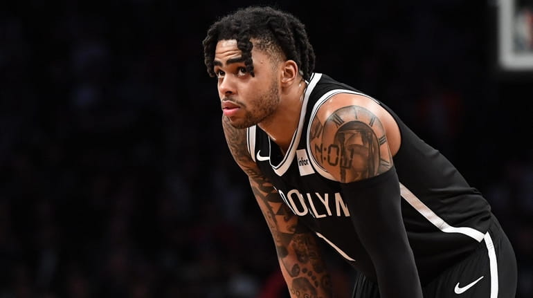 Nets guard D'Angelo Russell looks on against the Raptors during...