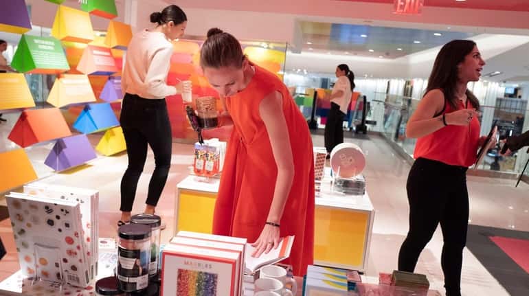 Shoppers browse the merchandise at Macy's Herald Square on the opening...