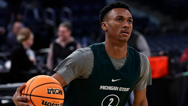 Michigan State guard Tyson Walker practices before an NCAA Tournament...