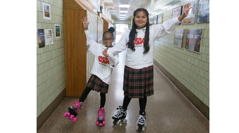 Kidsday reporters Elisha Mathurin, left, and Jaslyn Chavez from St....