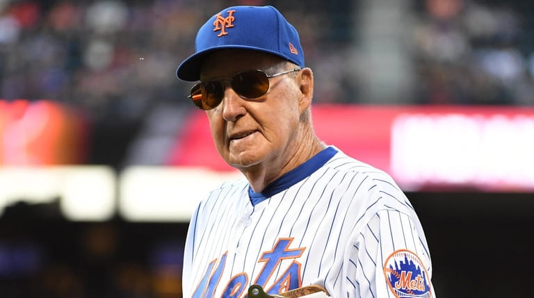 New York Mets interim pitching coach Phil Regan walks to...