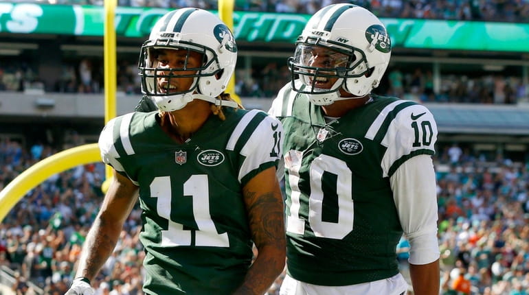 Jets wide receiver Robby Anderson celebrates his touchdown with Jermaine...