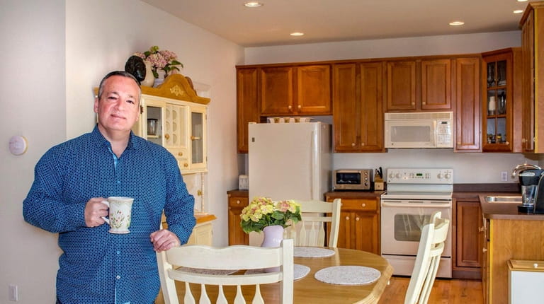 Michael Davidson in the kitchen of his four-bedrom Mattituck house...