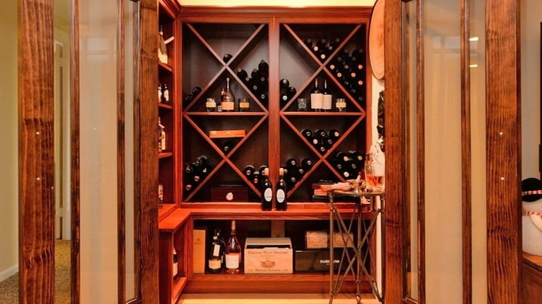 The wine room in this Glen Cove high-ranch is off...