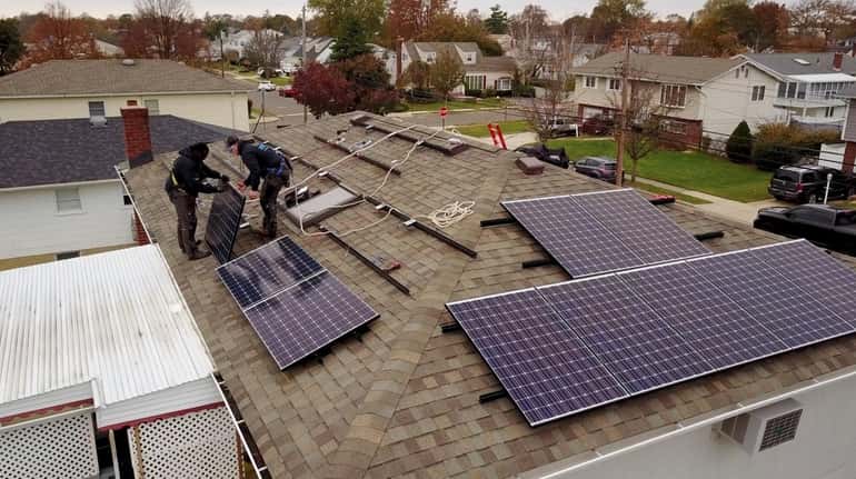 Installation of solar panels on the roofs of Long Island homes is...