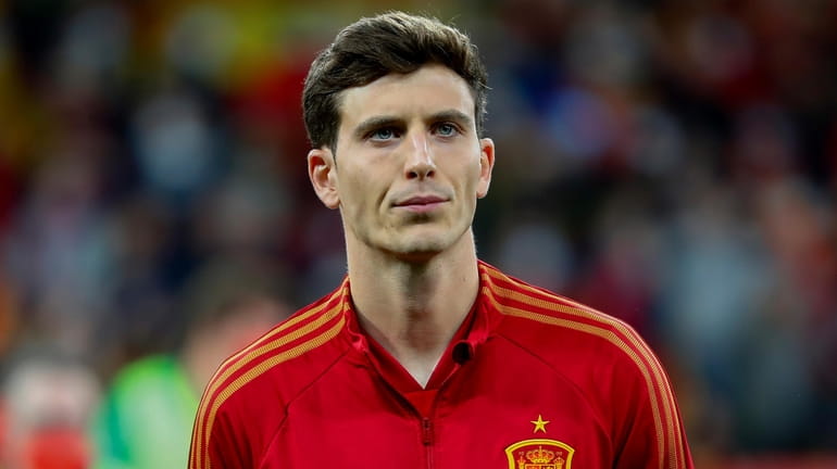 Spain's Pau Torres stands before an international friendly soccer match...