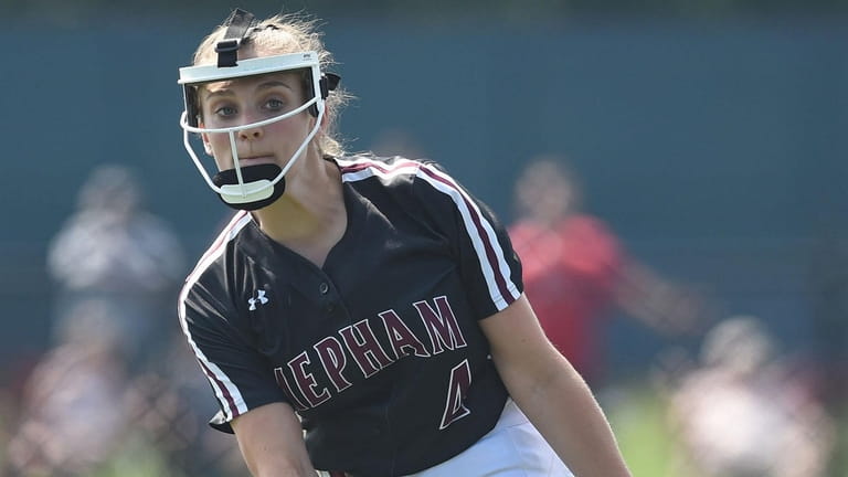 Giselle DeLutri #4, Mepham pitcher, delivers to the plate during...