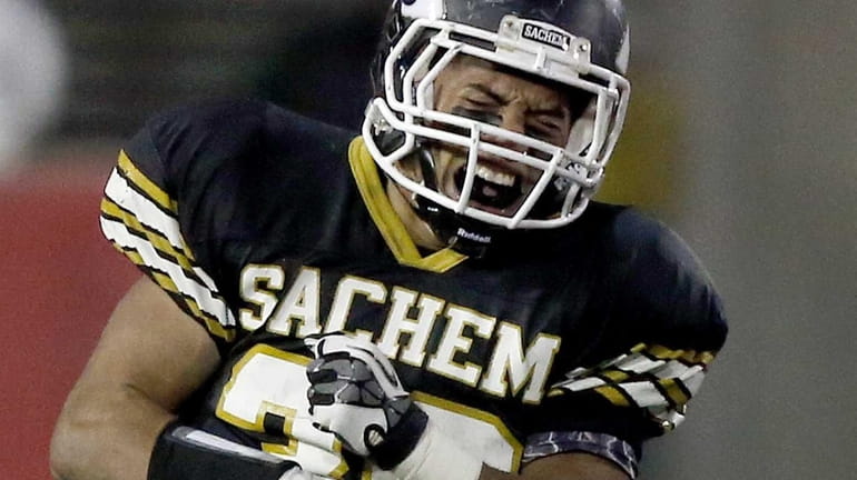 Sachem North's Justin Rivera celebrates after making a tackle in...