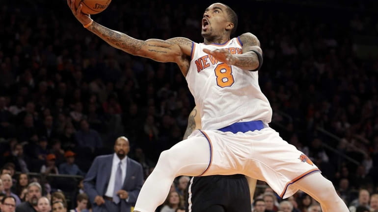 New York Knicks guard J.R. Smith shoots a layup against...