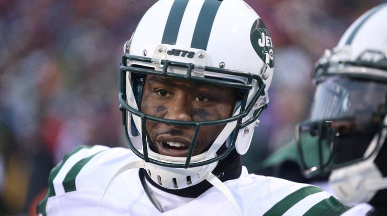 Brandon Marshall of the New York Jets looks on from...