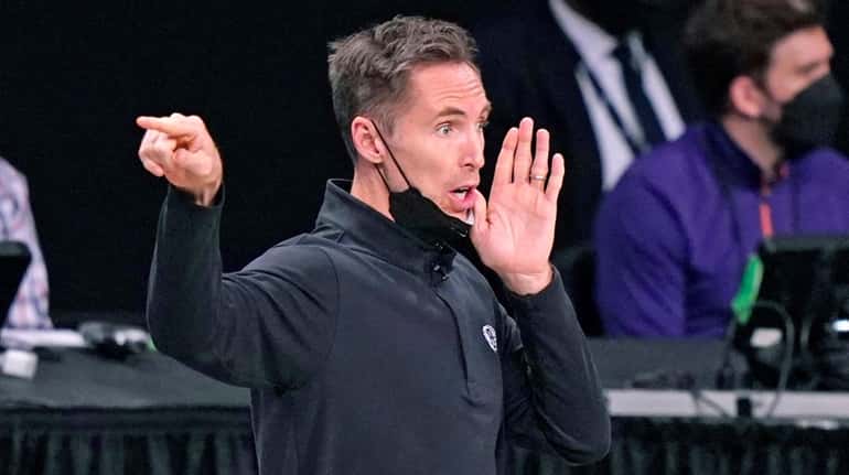 Nets head coach Steve Nash yells to his players during...