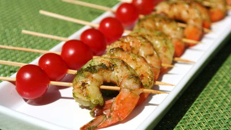 Green shrimp skewers, one of Three Simple summer appetizers, is...