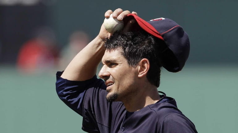 Minnesota Twins pitcher Carl Pavano looks on during a spring...