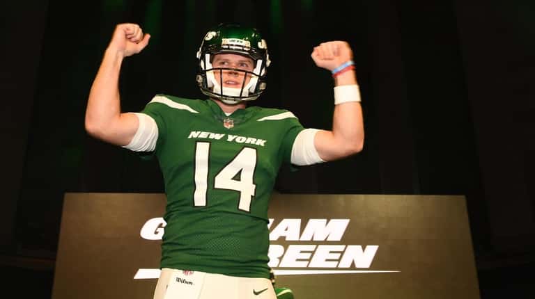 Jets quarterback Sam Darnold shows off the Gotham Green uniform...