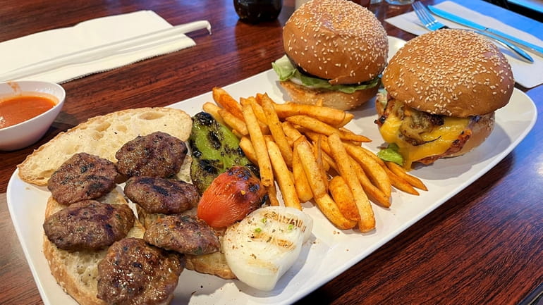 The kofte grill with Turkish meatballs, served together with a...