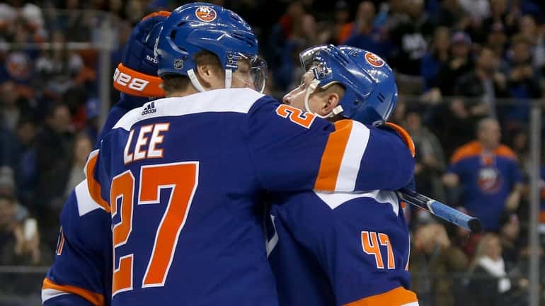 Anders Lee #27 of the New York Islanders celebrates his...