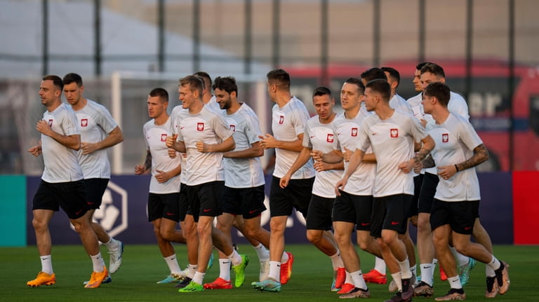 Poland players work out during a training session in Doha,...