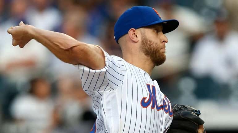 Mets pitcher Zack Wheeler delivers during the first inning against the Yankees...
