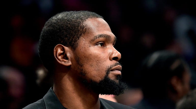 Kevin Durant of the Nets looks on during a game...