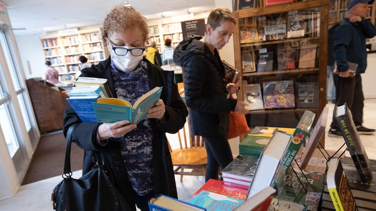 Paula Edelman, of Northport, browses at The Next Chapter.