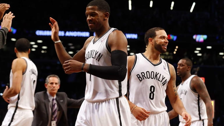 Joe Johnson and Deron Williams of the Nets celebrate after...