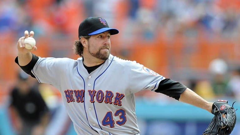 New York Mets pitcher R.A. Dickey throws against the Florida...