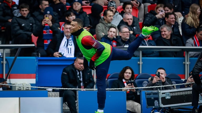 PSG's Kylian Mbappe warms up, during the French League One...