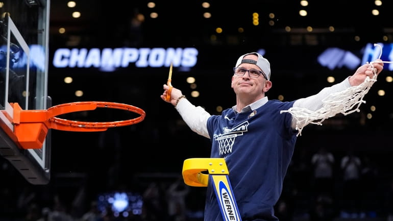 UConn head coach Dan Hurley celebrates after defeating Illinois in...